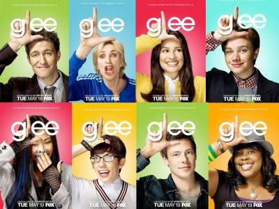 The ensemble cast of the popular musical TV show Glee, smiling and posing together. Watch Glee online to enjoy their performances.